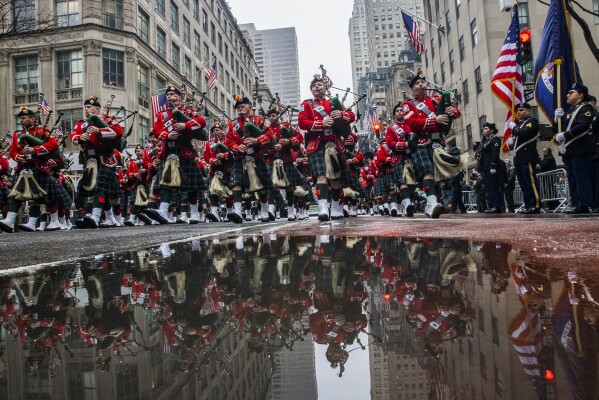 FILE - Bagpipers march up Fifth Avenue while they pass in front of St. Patrick Cathedral during the St. Patrick's Day Parade, Thursday, March 17, 2022, in New York. (AP Photo/Eduardo Munoz Alvarez, File)