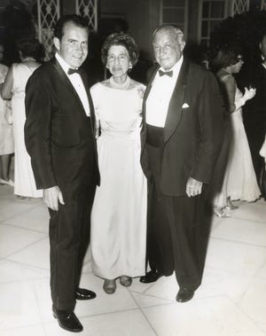 Nixon at a 1965 Palm Beach party with Mr. and Mrs. Bernard Gimbel.
