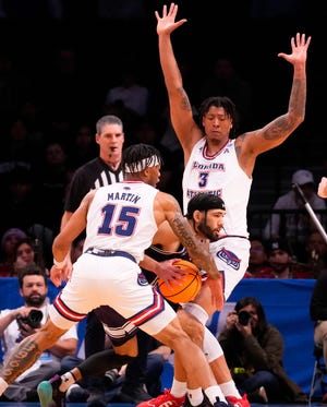 March 22, 2024, Brooklyn, NY, USA; Northwestern Wildcats guard Boo Buie (0) is defended by Florida Atlantic Owls guard Alijah Martin (15) and Florida Atlantic Owls forward Giancarlo Rosado (3) in the first round of the 2024 NCAA Tournament at the Barclays Center. Mandatory Credit: Robert Deutsch-USA TODAY Sports
