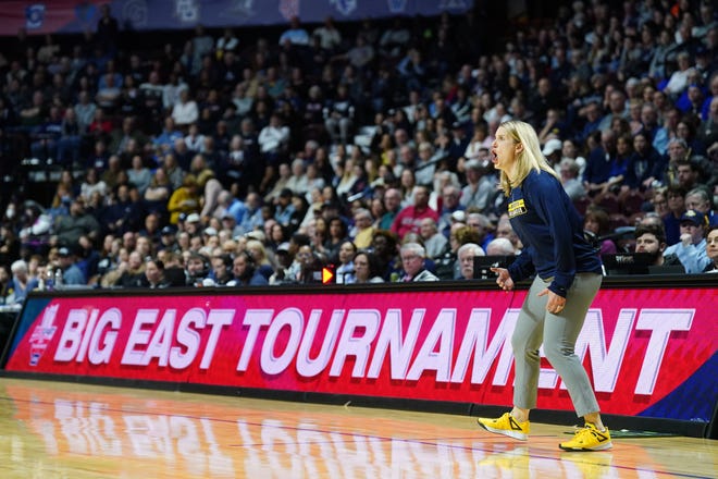 Mar 10, 2024; Uncasville, CT, USA; Marquette Golden Eagles head coach Megan Duffy watches from the sideline as they take on the UConn Huskies at Mohegan Sun Arena. Mandatory Credit: David Butler II-USA TODAY Sports