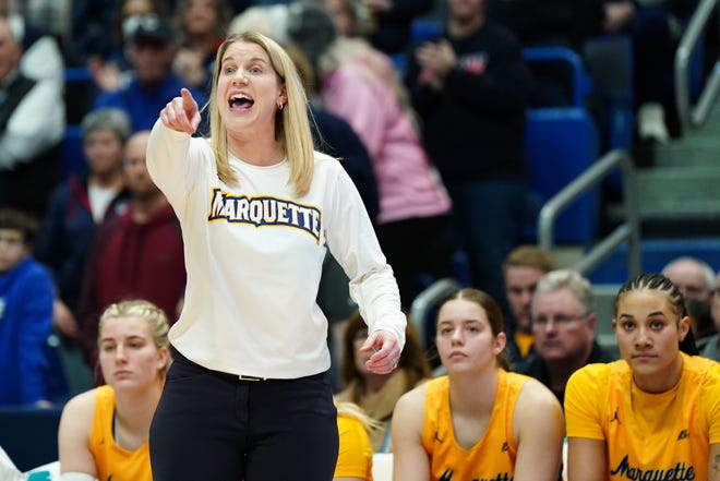 Dec 31, 2023; Hartford, Connecticut, USA; Marquette Golden Eagles head coach Megan Duffy watches from the sideline as they take on the UConn Huskies at XL Center. Mandatory Credit: David Butler II-USA TODAY Sports