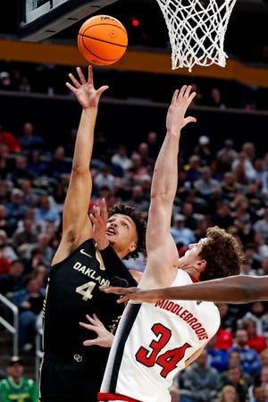 Mar 23, 2024; Pittsburgh, PA, USA; Oakland Golden Grizzlies forward Trey Townsend (4) shoots the ball against North Carolina State Wolfpack forward Ben Middlebrooks (34) during the first half in the second round of the 2024 NCAA Tournament at PPG Paints Arena. Mandatory Credit: Charles LeClaire-USA TODAY Sports
