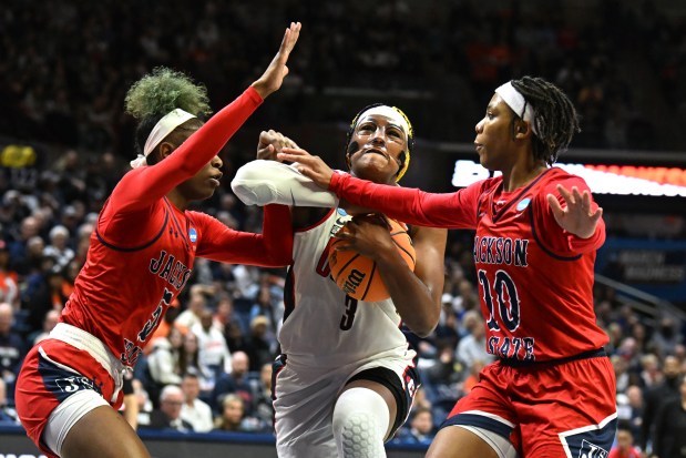 UConn Huskies forward Aaliyah Edwards (3) gets fouled by Jackson State Lady Tigers guard Keshuna Luckett (10) on her way to the basket in the second half of a first round NCAA Tournament game at Gampel Pavilion, Storrs, March 23, 2024. UConn won, 86-64. Photo by Cloe Poisson/Special to the Courant