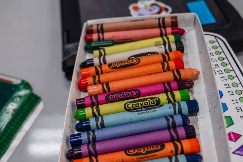 A box of crayons sit on a table in a classroom at Madison Elementary School in El Cajon on Nov. 9, 2023.