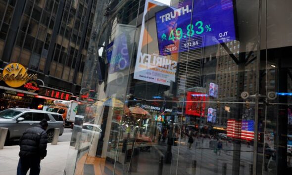 Trump Media & Technology Group stock market trading information is seen on a television at the Nasdaq Marketplace on March 26, 2024 in New York City.