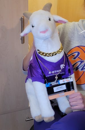 Gap Goat shows off his chains and NCAA Tournament credential Saturday in the Wildcats' locker room.