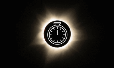 a graphic of a total solar eclipse during totality with a graphic animation of a stop clock in the center to depict the duration of the eclipse