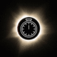 a graphic of a total solar eclipse during totality with a graphic animation of a stop clock in the center to depict the duration of the eclipse