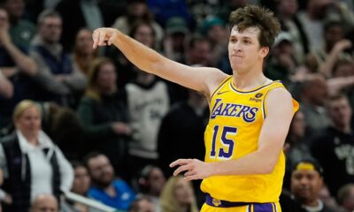 Los Angeles Lakers' Austin Reaves reacts after making a three pointer