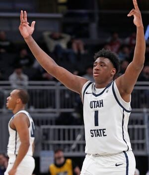 Utah State Aggies forward Great Osobor (1) reacts after scoring during NCAA Men’s Basketball Tournament game against the TCU Horned Frogs, Friday, March 22, 2024, at Gainbridge Fieldhouse in Indianapolis. Utah State Aggies won 88-72.