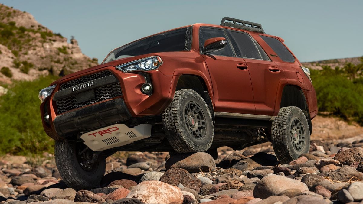 2024 Toyota 4Runner climbing over rocks.