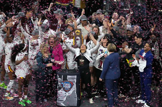 Head coach Dawn Staley, center, and the South Carolina Gamecocks celebrate after beating the Iowa Hawkeyes in the NCAA women's basketball national championship in Cleveland on Sunday, April 7. The No. 1 overall seed defeated Iowa 87-75 to win the school's third championship, completing a perfect 38-0 season.