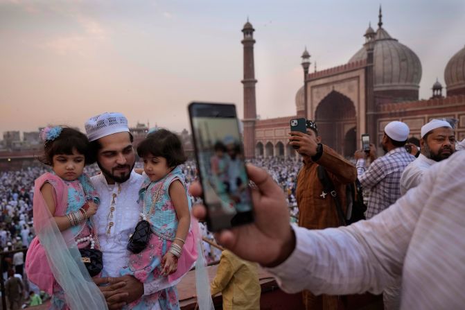 Muslims take selfies with their families after offering Eid al-Fitr prayer at Jama Masjid in New Delhi, India, on Thursday, April 11. See last week in 31 photos.