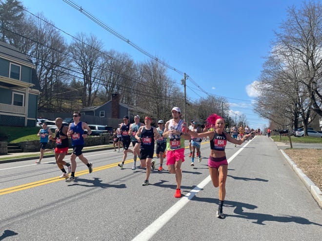 Boston Marathon runners in Natick, MA. April 15, 2024.
