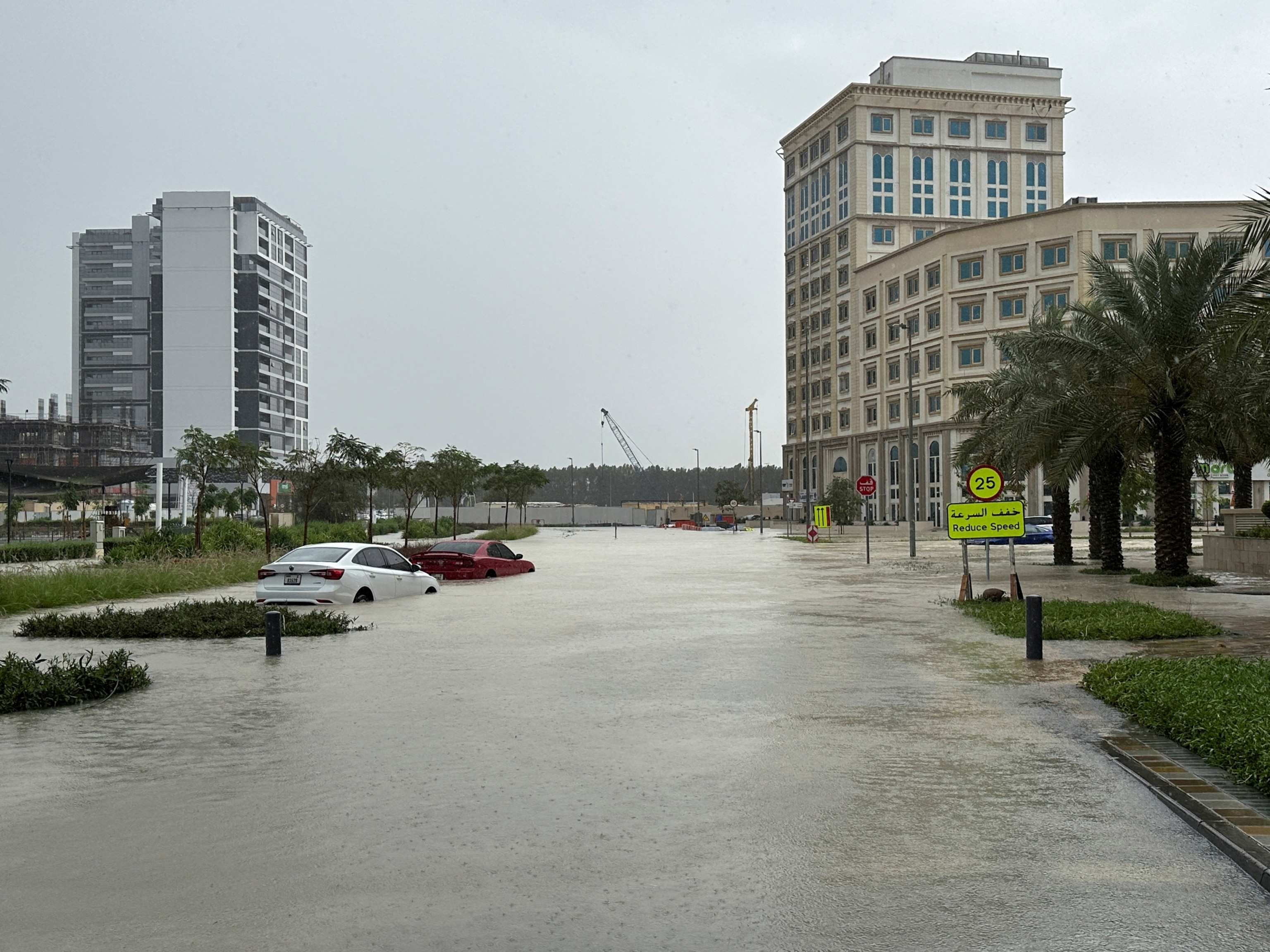 PHOTO: Cars are parked at a flooded street during a rain storm in Dubai, United Arab Emirates, April 16, 2024. 