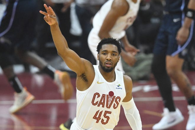 Cavaliers guard Donovan Mitchell celebrates his first-quarter 3-pointer against the Orlando Magic during Game 2 of the first-round playoff series, April 22, 2024, in Cleveland.