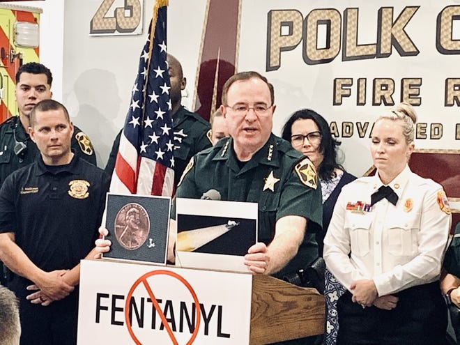 Polk County Sheriff Grady Judd displays a picture of a penny to represent a lethal dose of fentanyl. Judd joined Gov. Ron DeSantis Thursday afternoon for the signing of House Bill 95 that cracks down on dealing of fentanyl and other methamphetamines.