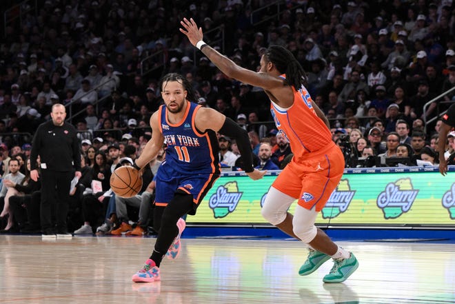Mar 31, 2024; New York, New York, USA; New York Knicks guard Jalen Brunson (11) drives to the basket while being defended by Oklahoma City Thunder guard Cason Wallace (22) during the second quarter at Madison Square Garden. Mandatory Credit: John Jones-USA TODAY Sports