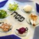At least five foods go on the Seder plate, including shank bone, egg, bitter herbs, vegetables and sweet paste. Many Seder plates have room for hazeret, another form of bitter herb.