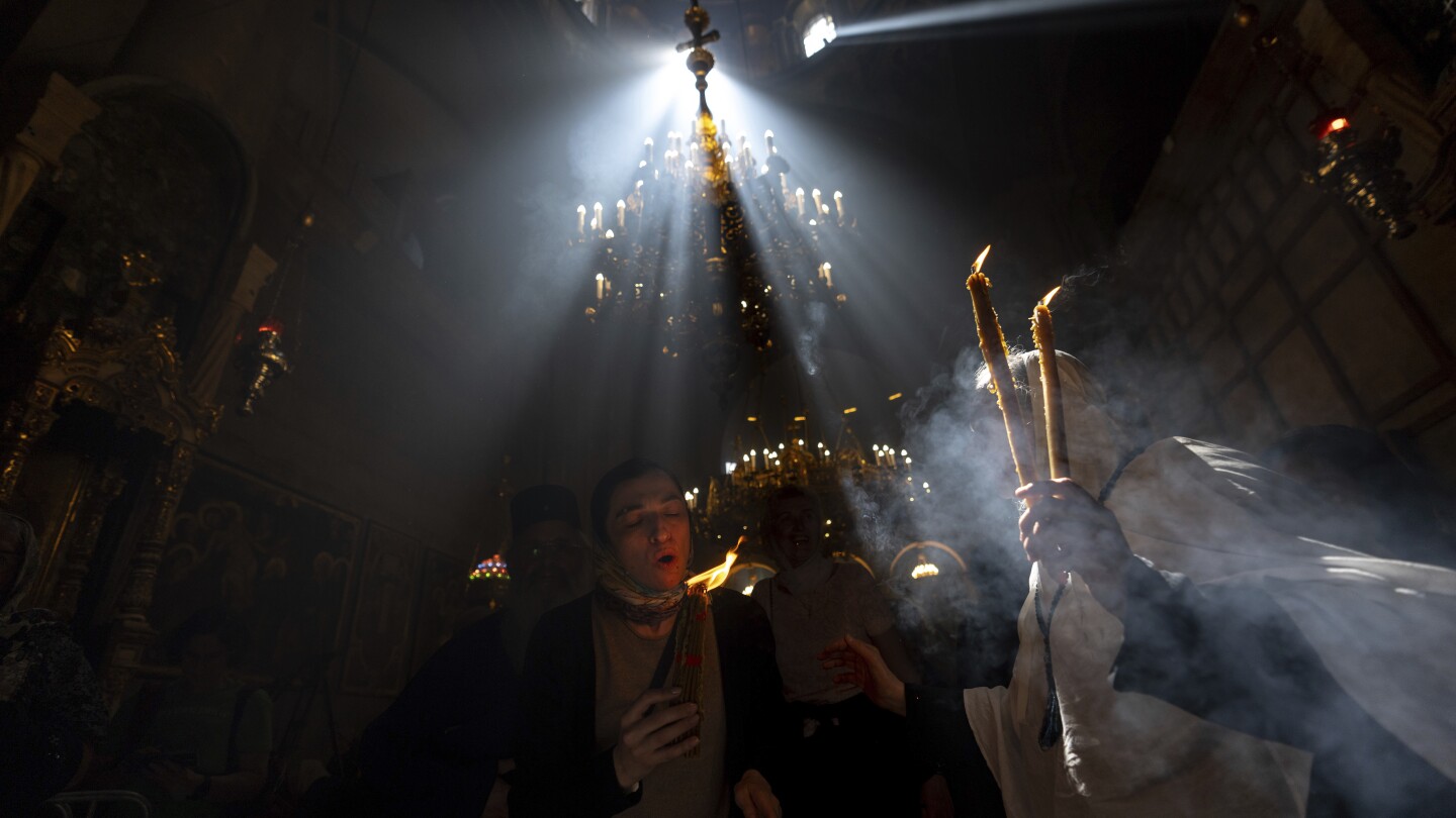 Cheers and flames as Orthodox worshipers greet the ancient ceremony of the 'Holy Fire'