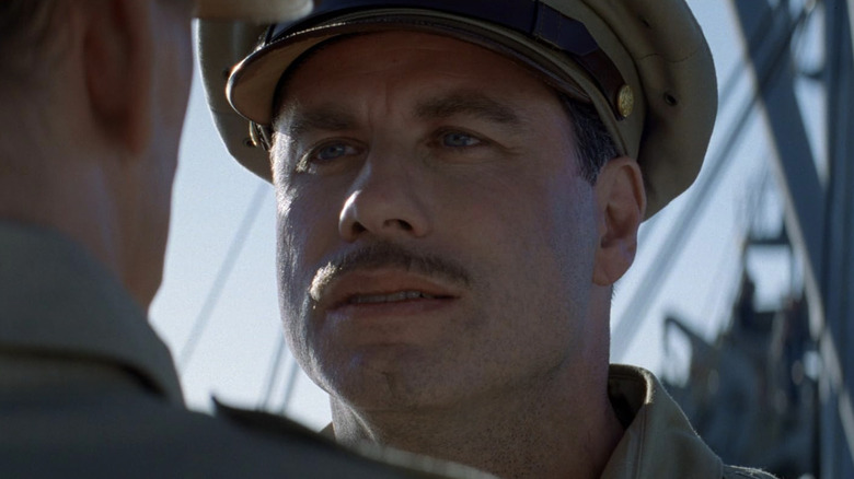 John Travolta as Brig. Gen. Howard Quintard talking to Nick Nolte as Lt. Col. Gordon Tall on a ship in The Thin Red Line