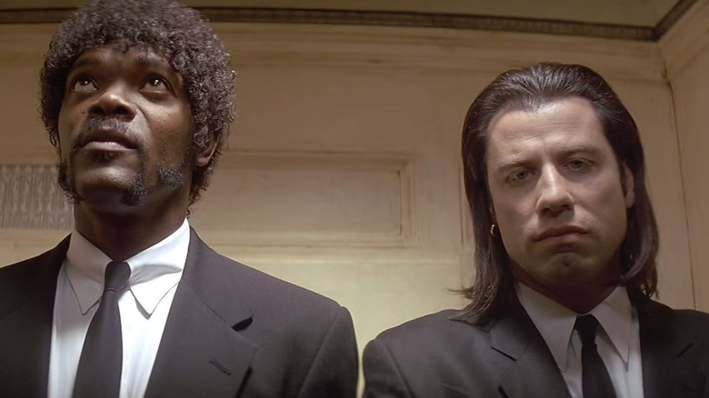 Samuel L. Jackson as Jules and John Travolta as Vincent Vega in an elevator in Pulp Fiction