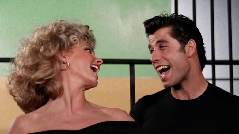 Olivia Newton-John as Sandy Olsson and John Travolta as Danny Zucko sing 