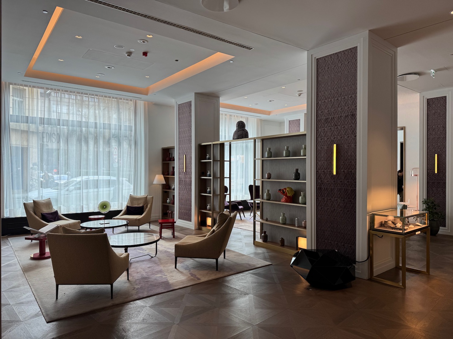 a room with a couch and a bookcase
