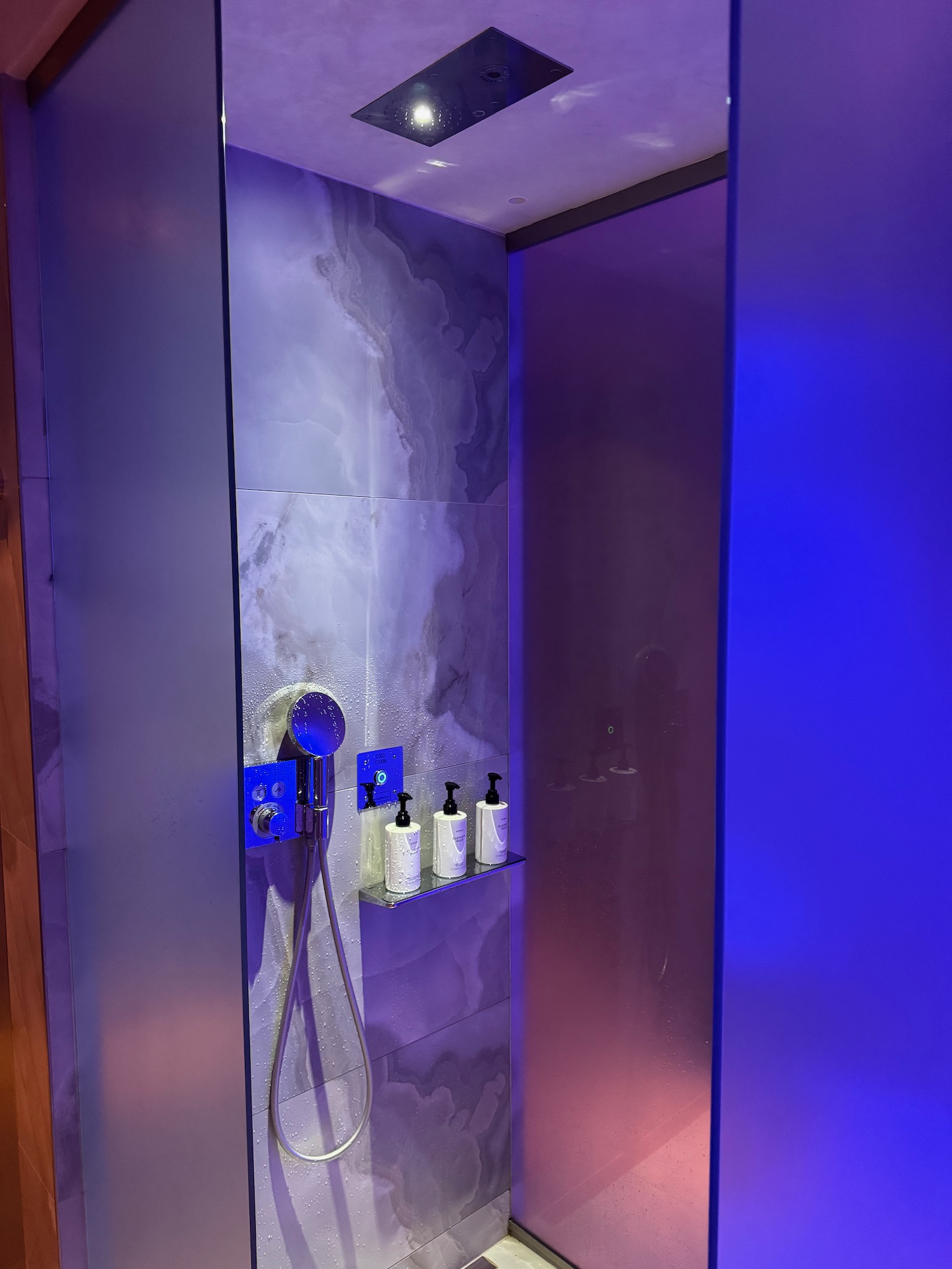 a shower with a shower head and a shower head