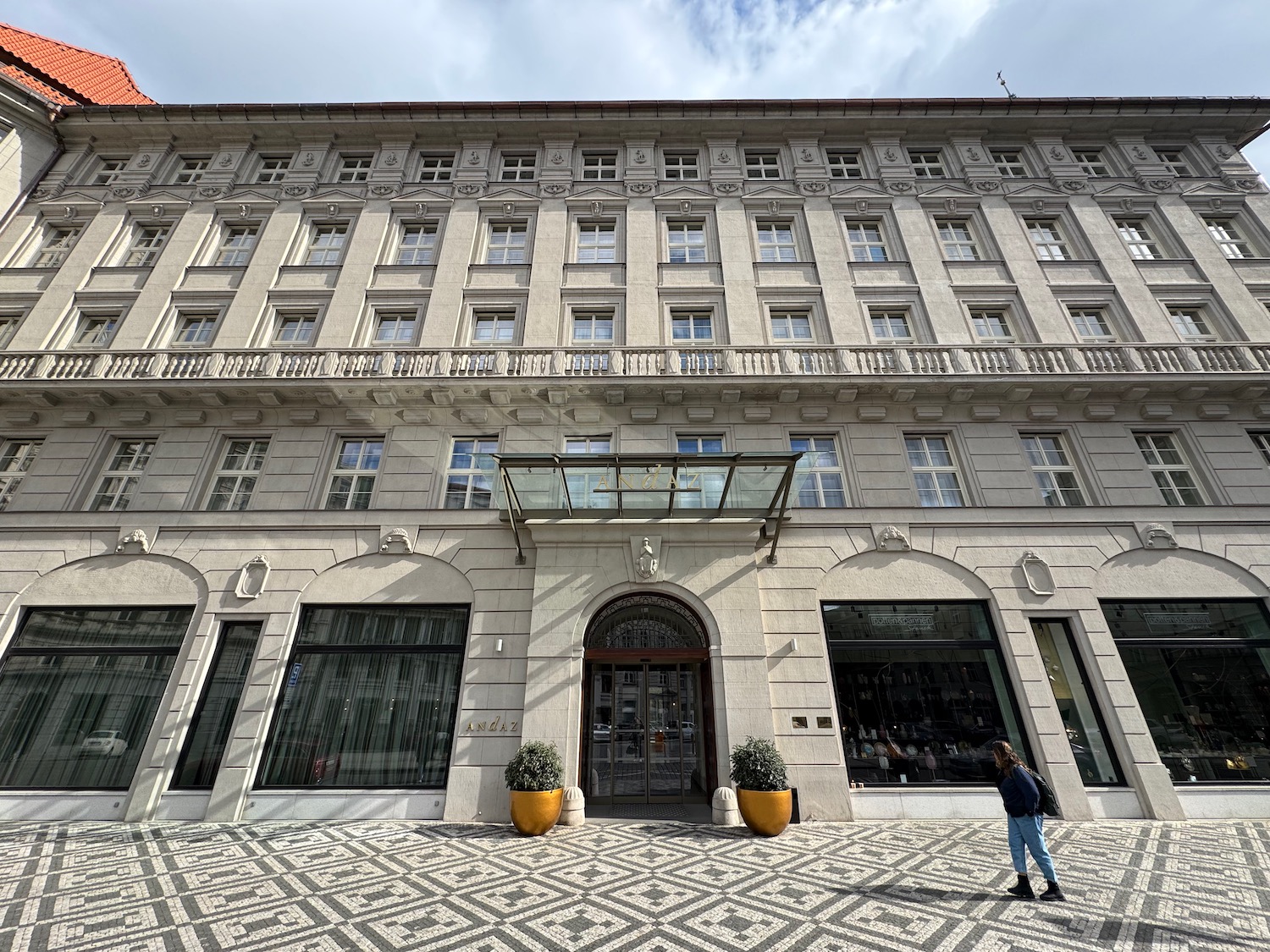 a building with a person walking in front of it