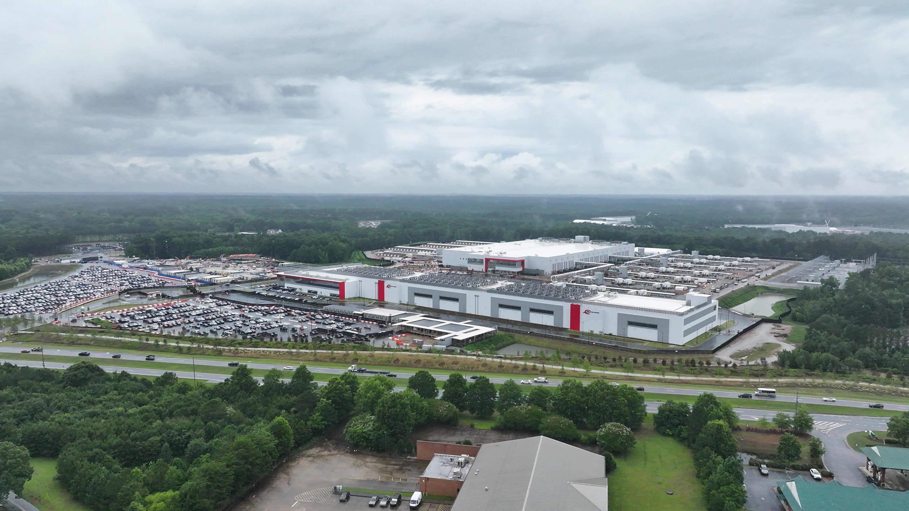 An aerial view captures a large area under construction for a new data center campus near Fayetteville. Georgia Power has said increased sales to data centers could lead to “downward pressure” on residential customers’ rates. (Miguel Martinez/AJC)