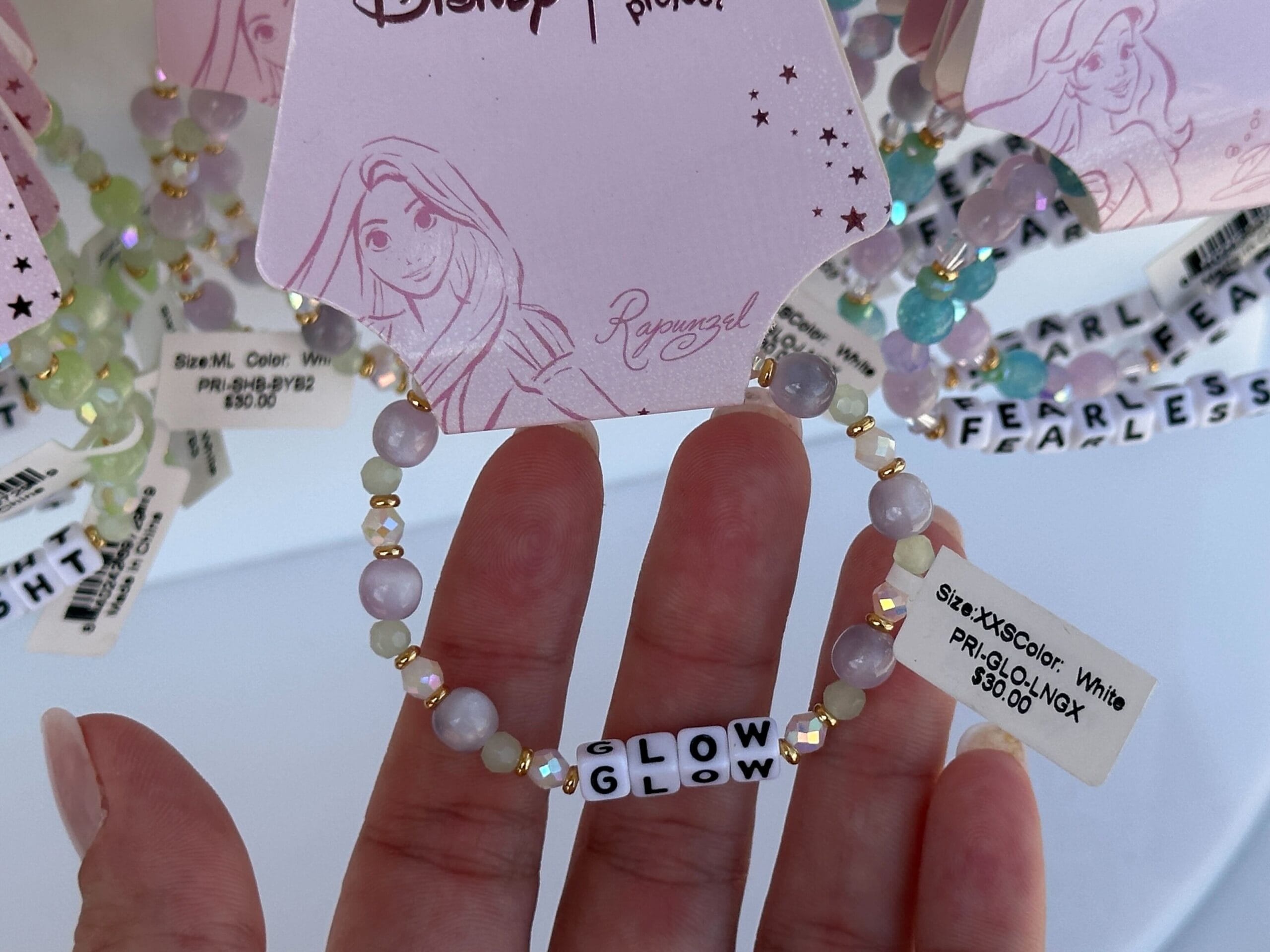 Hand holding a beaded bracelet with