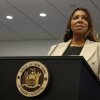 New York Attorney General Letitia James stands behind a lectern equipped with a microphone while she speaks during a news conference on January 8, 2025.