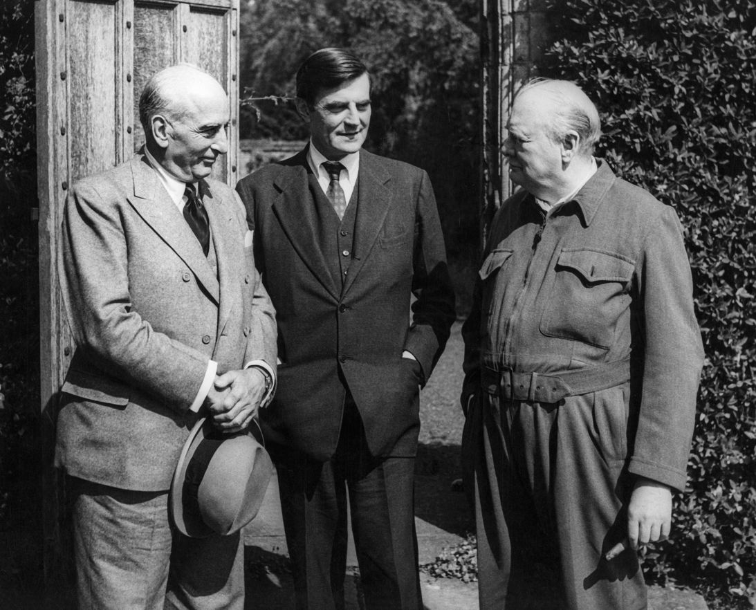 Joseph Davies, personal representative of President Harry S. Truman; John Winant, US ambassador to London; and Winston Churchill photographed in Chequers Garden, UK circa 1940.