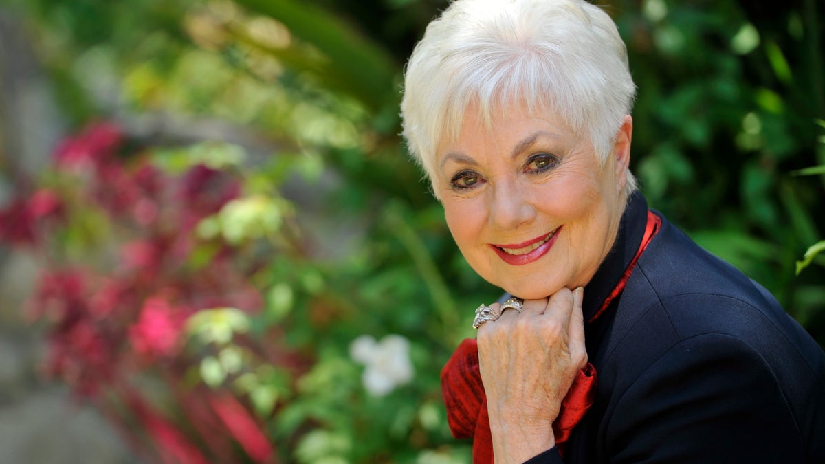 FILE - In this July 15, 2013 file photo, actress Shirley Jones poses for a portrait at her home in Los Angeles. Jones wants to mark her 80th birthday with a high-flying adventure. The Oscar-winning actress and singer says she plans to go skydiving on Monday, March 31, 2014, her birthday, for the first time. (Photo by Chris Pizzello/Invision/AP, File)