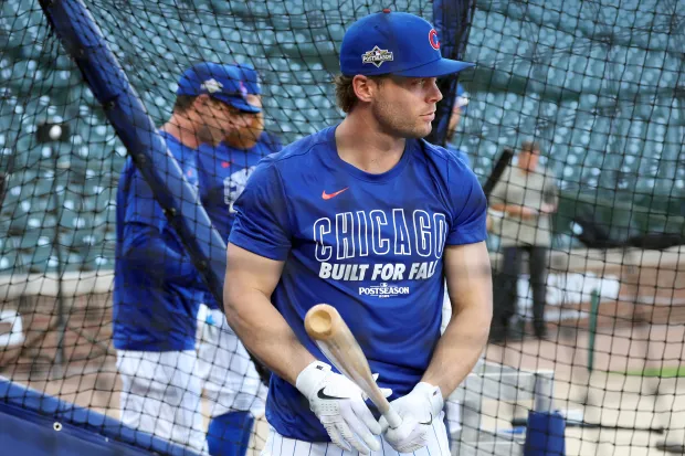 Chicago Cubs infielder Nico Hoerner takes batting practice at Wrigley...