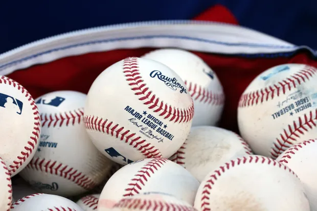 Baseballs used in practice at Wrigley Field on Sept. 29,...